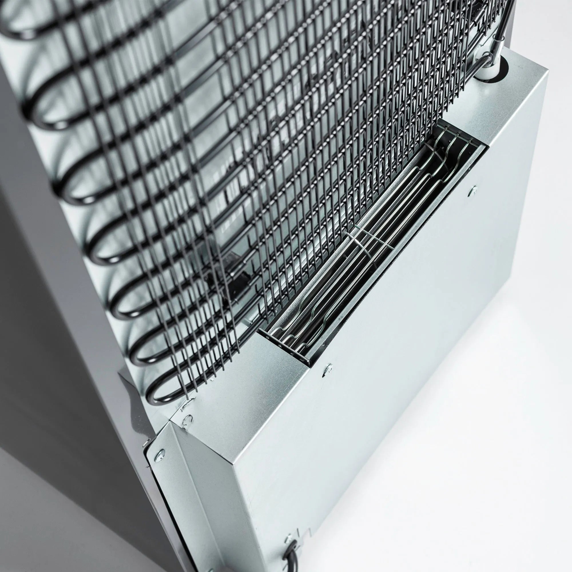 Close-up of a metal grid on a white background