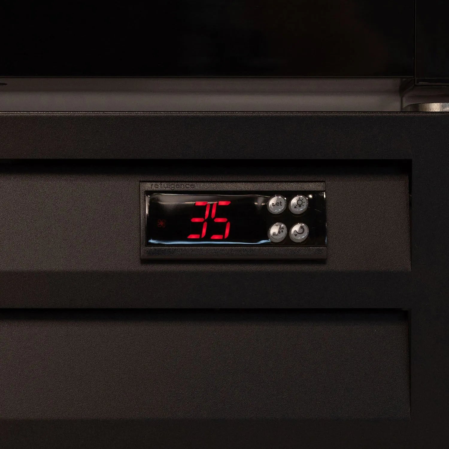 Digital temperature display on a black appliance with red numbers.