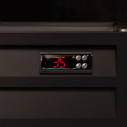 Digital temperature display on a black appliance with red numbers.