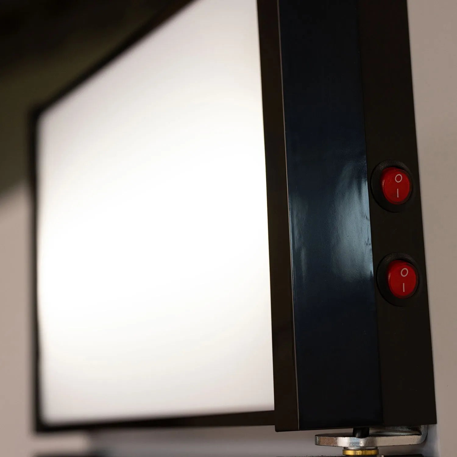 Light box with red power buttons on a neutral background