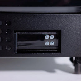 Control panel with buttons and display on a black electronic device