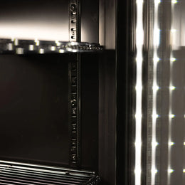 Close-up of a black shelf device with led