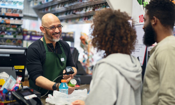 convenience store strategy; image of store clerk serving customers
