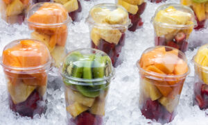 commercial ice maker for grocery stores, fruit cups in a cooler with ice