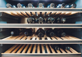 Storing,Bottles,Of,Wine,In,Fridge.,Alcoholic,Card,In,Restaurant.
